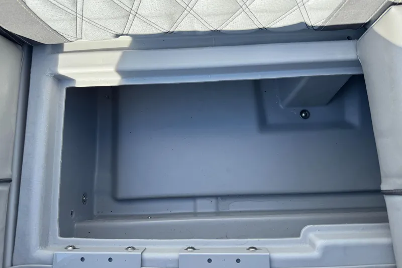 Slide: The Image of Storage compartment of a 2019 Bennington R 25 RSR boat, featuring a spacious interior. - 29
