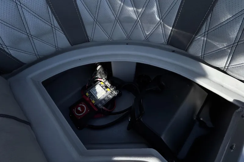 Slide: The Image of Storage compartment in 2019 Bennington R 25 RSR boat with battery and wiring. - 30