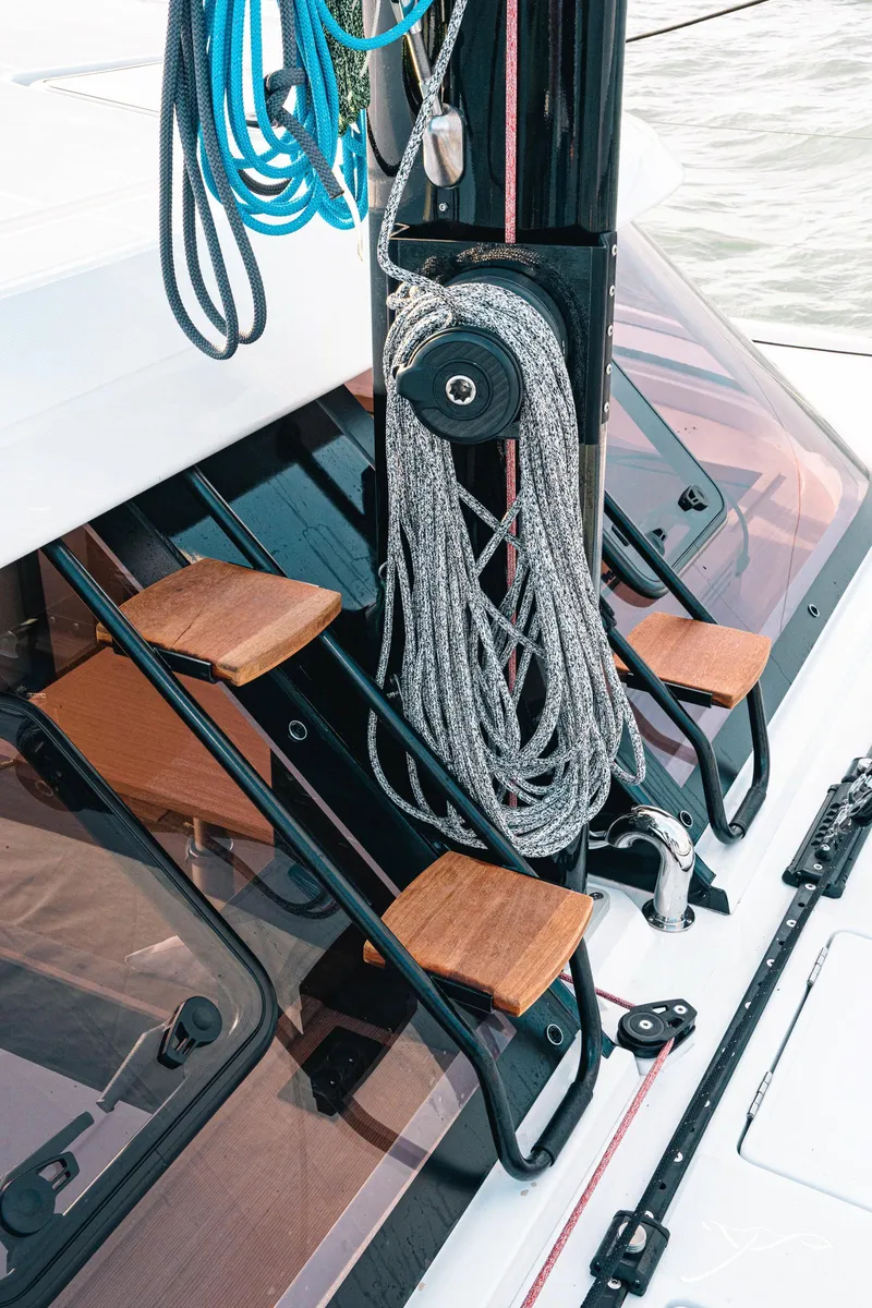 Slide: The Image of Nautitech 40 Open 2025 yacht with ropes and wooden steps on deck. - 15