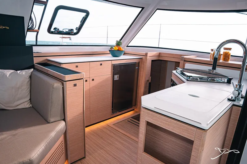 Slide: The Image of Modern kitchen interior of 2025 Nautitech 40 Open catamaran, featuring sleek design and compact appliances. - 36