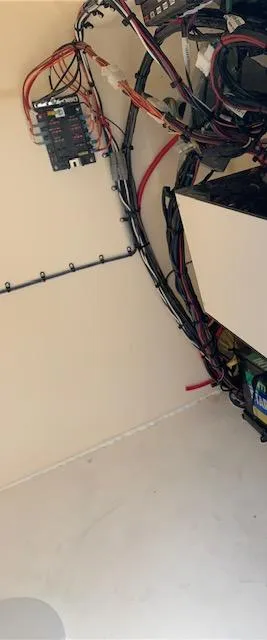 Slide: The Image of Interior wiring of 2025 Jones Brothers 23 Cape Fisherman boat, showcasing electrical components. - 11