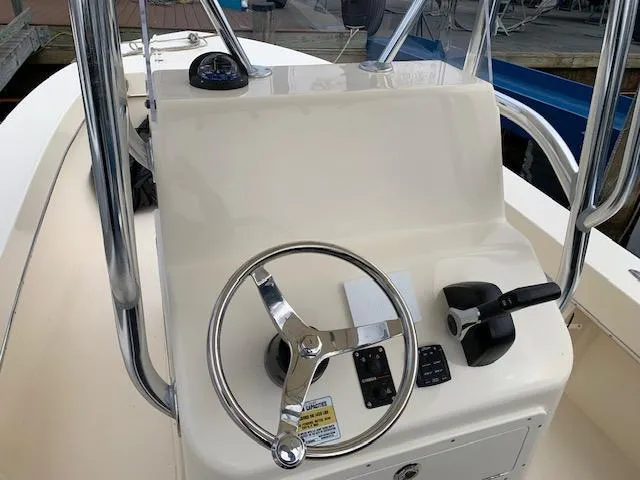 Slide: The Image of Steering console of 2025 Jones Brothers 23 Cape Fisherman boat, featuring modern controls. - 9