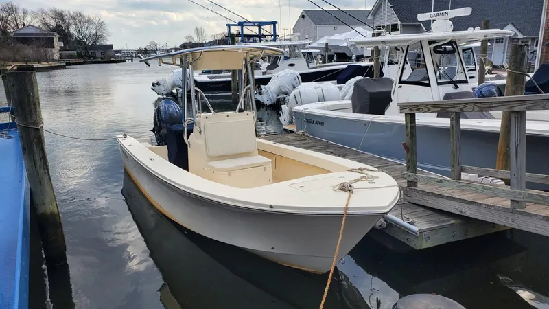 The Image of 2025 Jones Brothers 23 Cape Fisherman boat docked in a marina. - 0