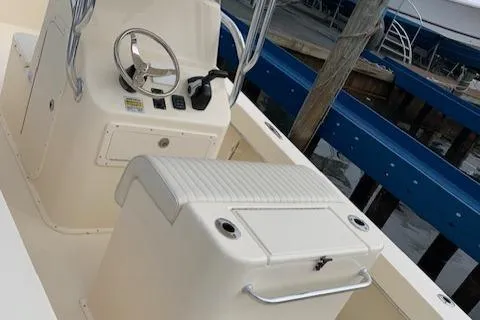 Slide: The Image of 2025 Jones Brothers 23 Cape Fisherman boat interior with steering console and seating. - 13