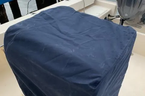 Slide: The Image of Covered engine on 2025 Jones Brothers 23 Cape Fisherman boat. - 16