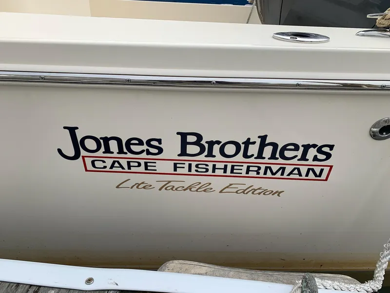 Slide: The Image of Jones Brothers 23 Cape Fisherman Lite Tackle Edition boat, 2025 model, docked. - 7
