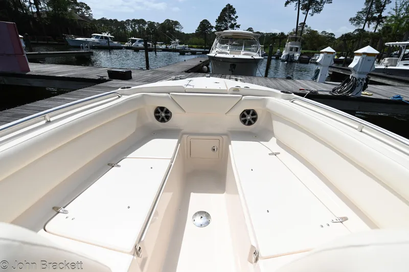 Slide: The Image of 2019 Grady-White Freedom 275 boat interior at a marina dock. - 18