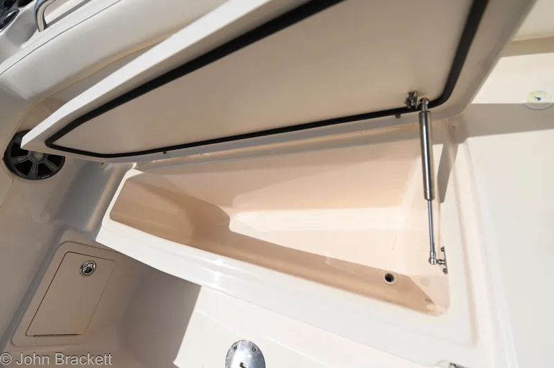 Slide: The Image of Open storage compartment on 2019 Grady-White Freedom 275 boat. - 19