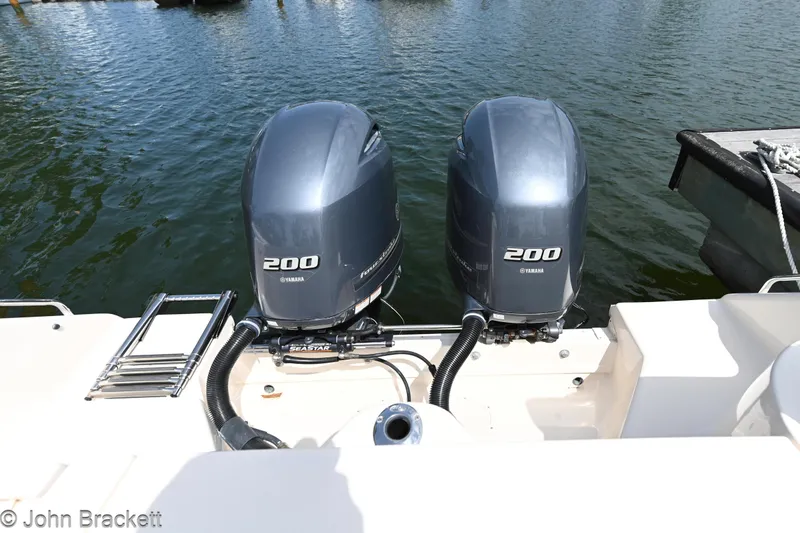 Slide: The Image of 2019 Grady-White Freedom 275 with twin 200 horsepower Yamaha outboard engines on water. - 34