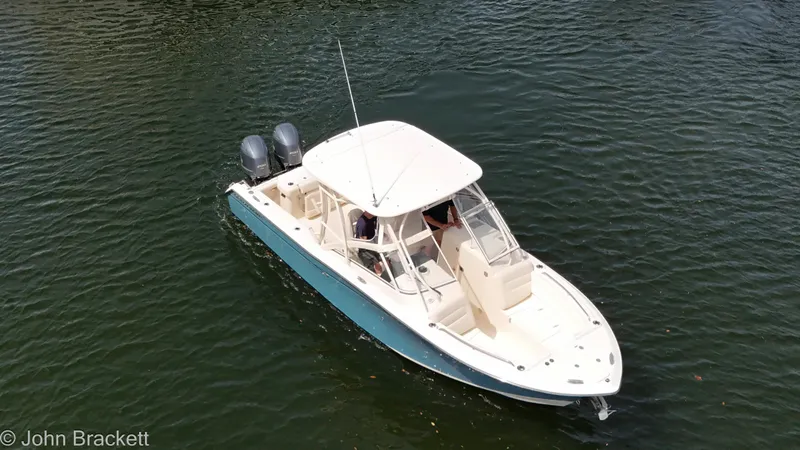 Slide: The Image of 2019 Grady-White Freedom 275 boat on water, aerial view, dual engines. - 35