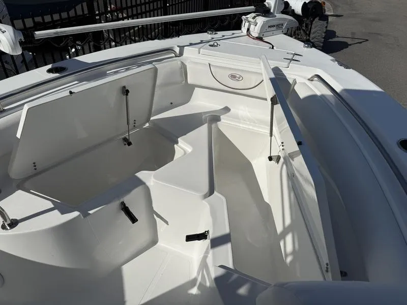 Slide: The Image of 2019 Sea Hunt Ultra 211 boat interior with open storage compartments. - 5