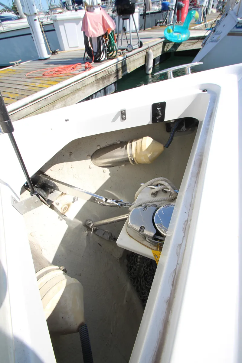 Slide: The Image of 2016 Cobalt R30 boat anchor compartment at marina dock. - 14