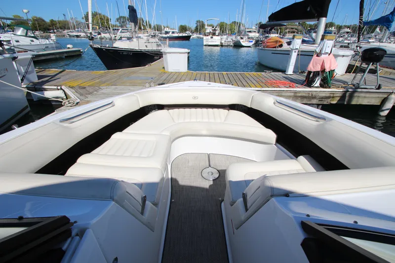 Slide: The Image of Bow seating area of a 2016 Cobalt R30 boat docked at a marina. - 20