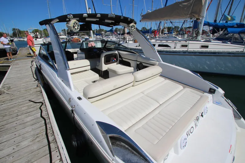 Slide: The Image of 2016 Cobalt R30 boat docked, featuring spacious seating and sleek design. - 36