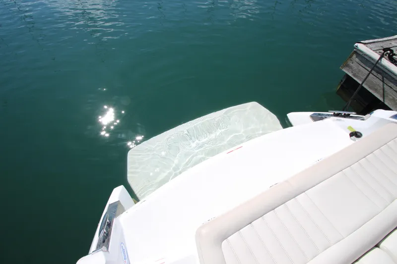 Slide: The Image of 2016 Cobalt R30 boat with sunlit swim platform on calm water. - 4