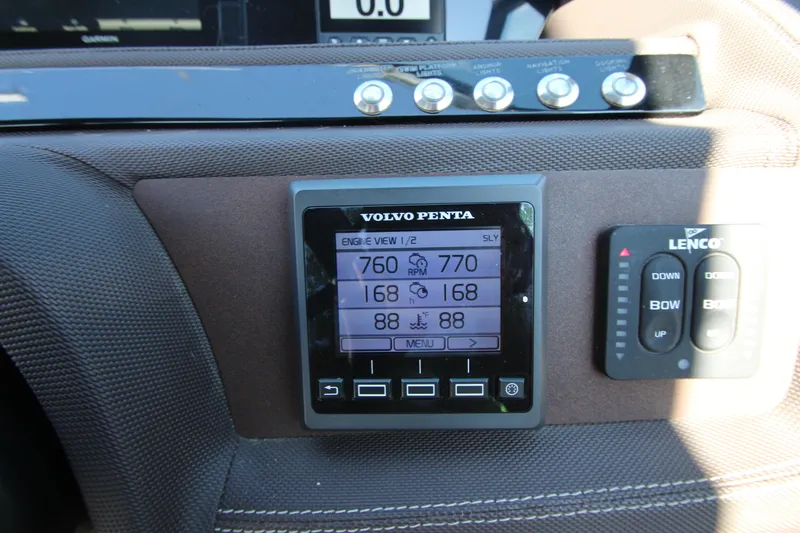 Slide: The Image of Dashboard of a 2016 Cobalt R30 boat featuring Volvo Penta display and controls. - 47