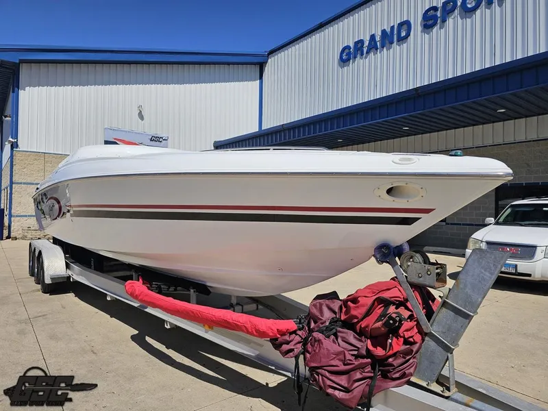 Slide: The Image of 2002 Baja 342 boat on trailer outside Grand Sport building. - 11