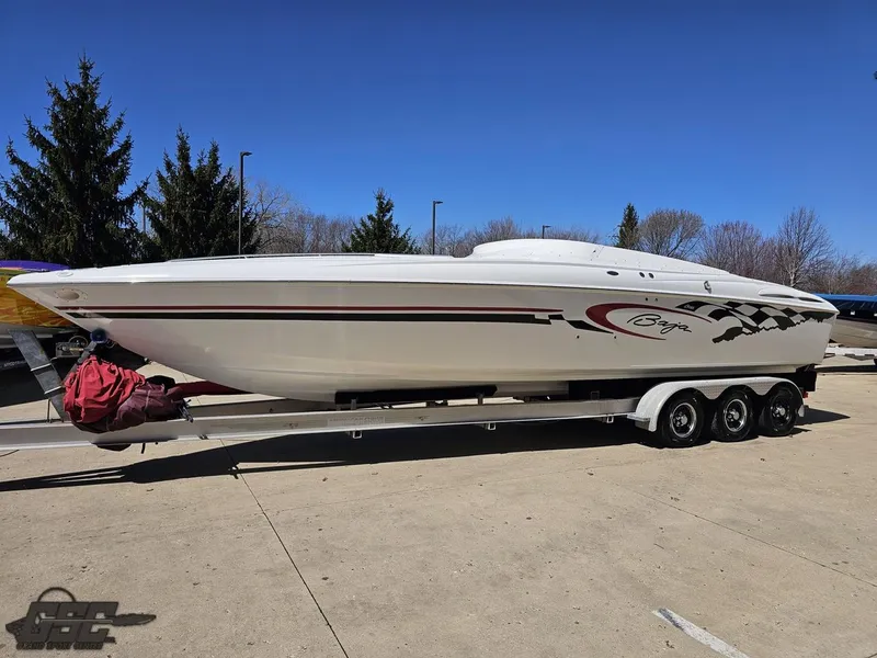 Slide: The Image of 2002 Baja 342 speedboat on a trailer, parked outdoors under a clear blue sky. - 15