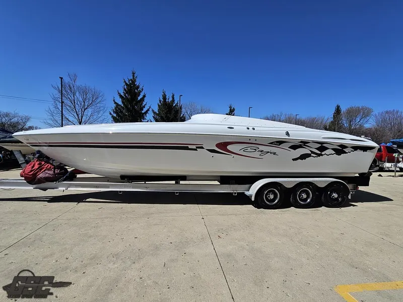Slide: The Image of 2002 Baja 342 speedboat on trailer, white with red and black accents, parked outdoors. - 16