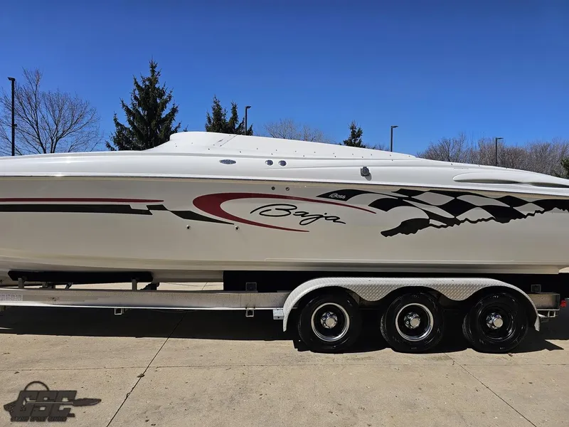 Slide: The Image of 2002 Baja 342 speedboat on a trailer, featuring sleek design and racing graphics. - 18