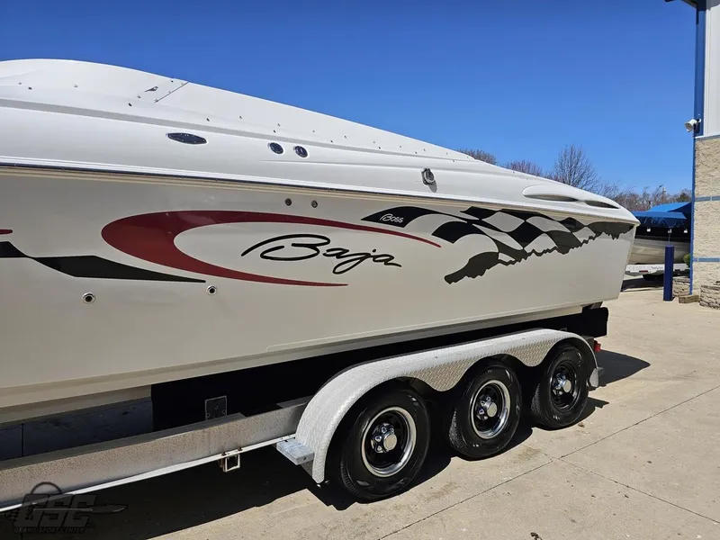 Slide: The Image of 2002 Baja 342 boat on trailer, featuring sleek design and racing graphics. - 20