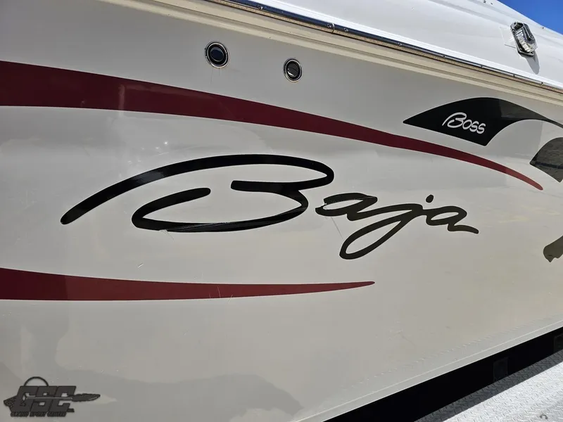 Slide: The Image of 2002 Baja 342 boat with sleek design and bold logo on the side. - 21