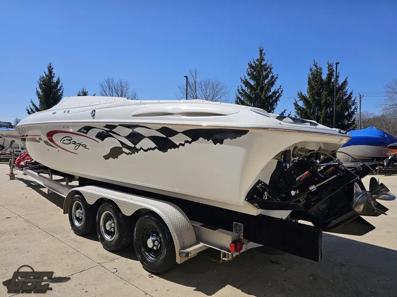 Slide: The Image of 2002 Baja 342 speedboat on a trailer, featuring sleek design and vibrant graphics. - 25