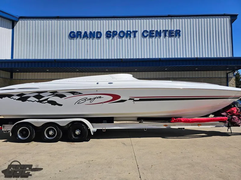 Slide: The Image of 2002 Baja 342 speedboat on trailer at Grand Sport Center, featuring sleek design and racing graphics. - 3