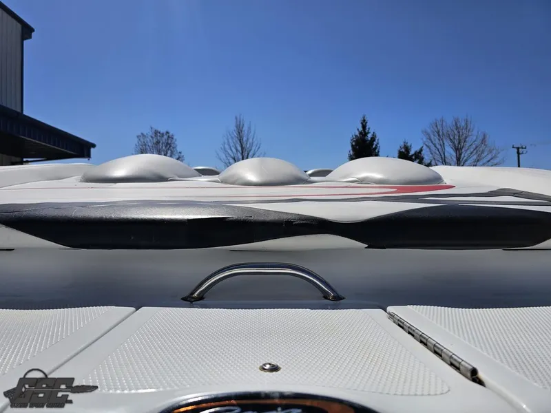 Slide: The Image of 2002 Baja 342 boat deck with sleek design under clear blue sky. - 33