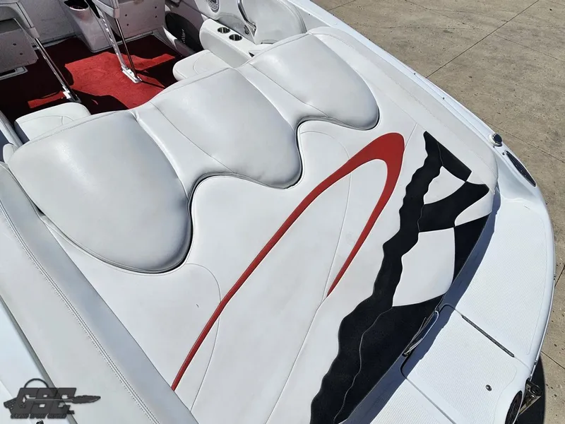Slide: The Image of 2002 Baja 342 boat interior with white and red seating, stylish design. - 35