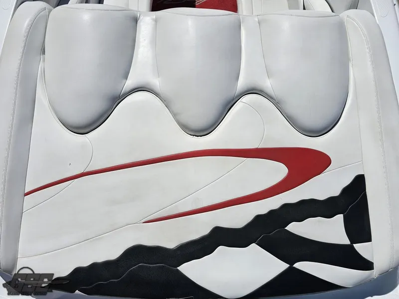 Slide: The Image of White and red interior design of a 2002 Baja 342 boat seat. - 38