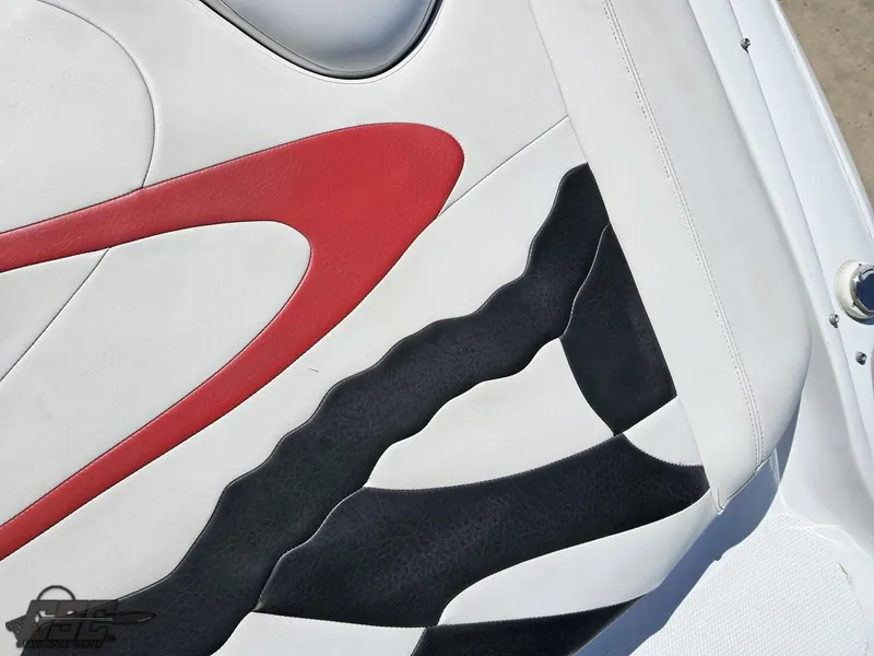 Slide: The Image of 2002 Baja 342 boat seat with red, black, and white design. - 41