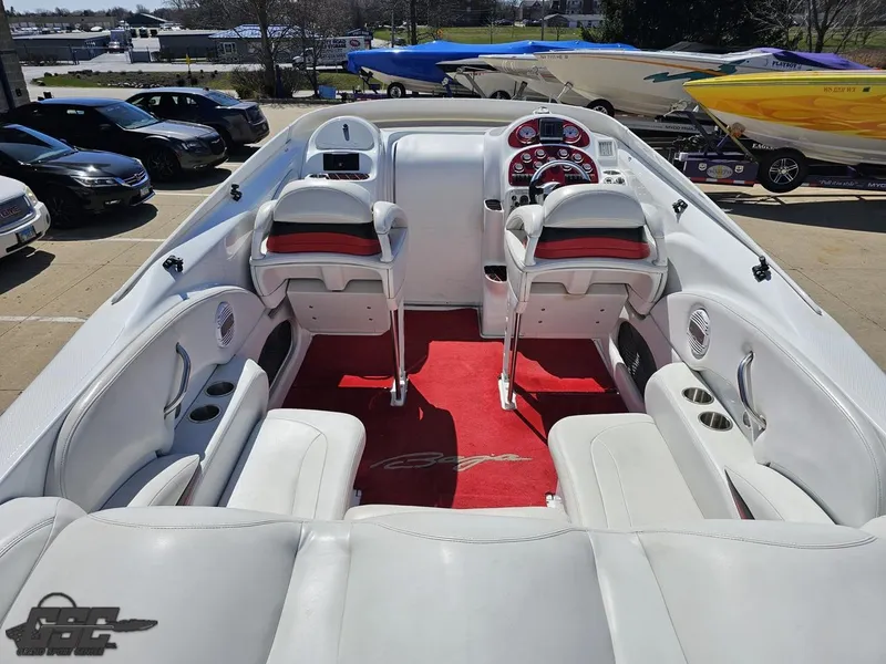 Slide: The Image of Interior of a 2002 Baja 342 boat with white seating and red accents. - 43