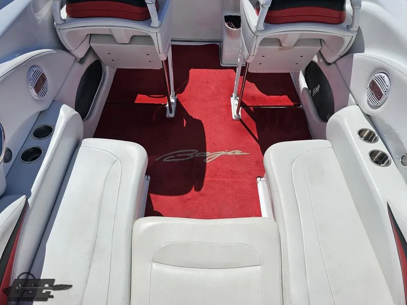 Slide: The Image of 2002 Baja 342 boat interior with white seats and red carpet. - 46