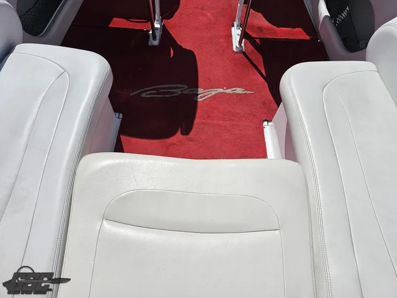 Slide: The Image of Interior of 2002 Baja 342 boat with red carpet and white seating. - 47
