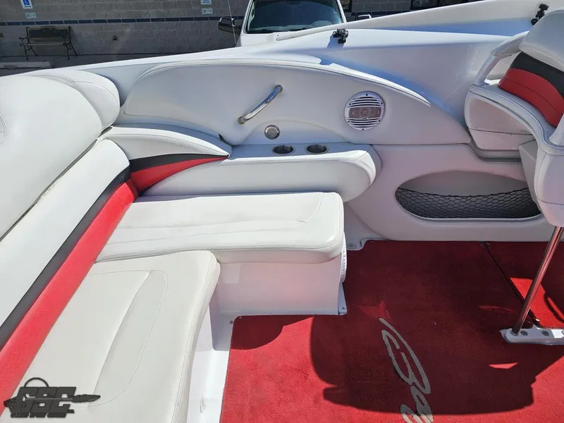 Slide: The Image of Interior of a 2002 Baja 342 boat with white and red seating. - 48