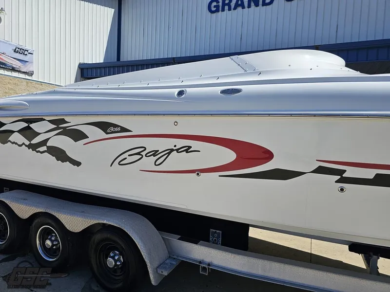 Slide: The Image of 2002 Baja 342 speedboat on trailer, featuring sleek design and bold graphics. - 6
