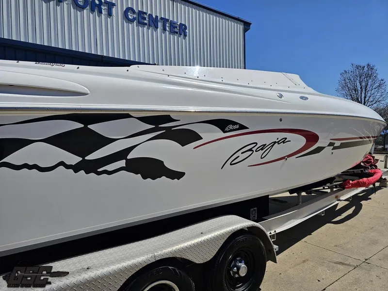 Slide: The Image of 2002 Baja 342 boat on trailer, featuring sleek design and bold graphics. - 8