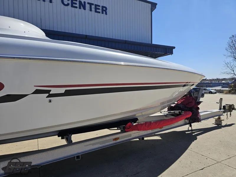 Slide: The Image of 2002 Baja 342 boat on trailer outside a service center. - 9
