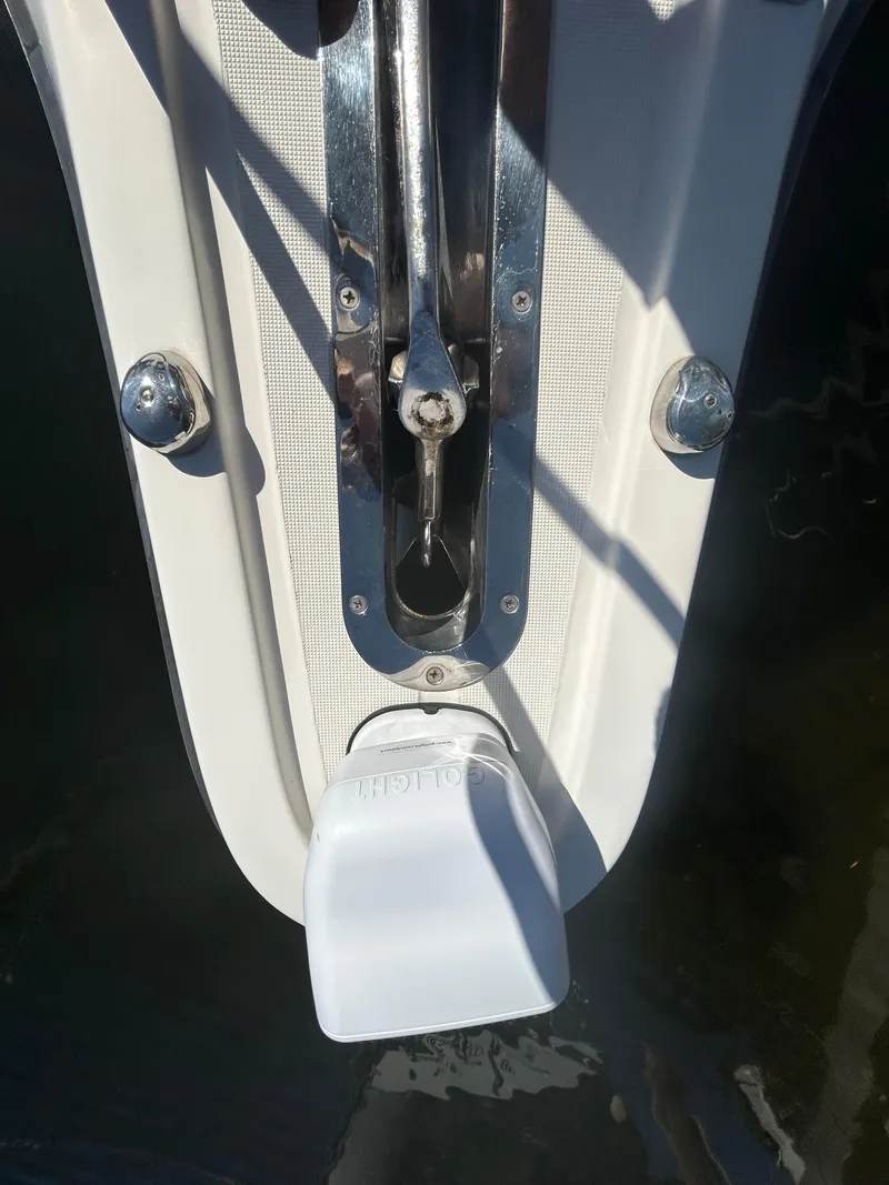 Slide: The Image of 1998 Tiara Yachts 3500 Express anchor mechanism detail with white cover. - 24