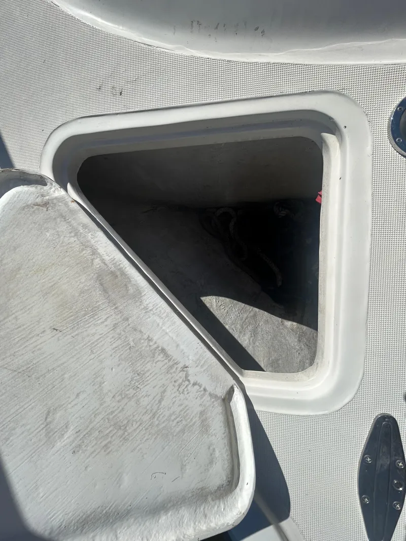 Slide: The Image of Open storage compartment on a 1998 Tiara Yachts 3500 Express boat. - 25