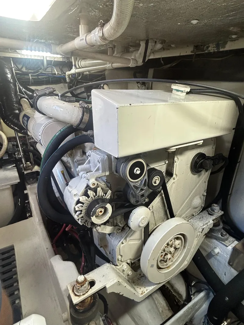 Slide: The Image of Engine compartment of a 1998 Tiara Yachts 3500 Express, showcasing mechanical components. - 33