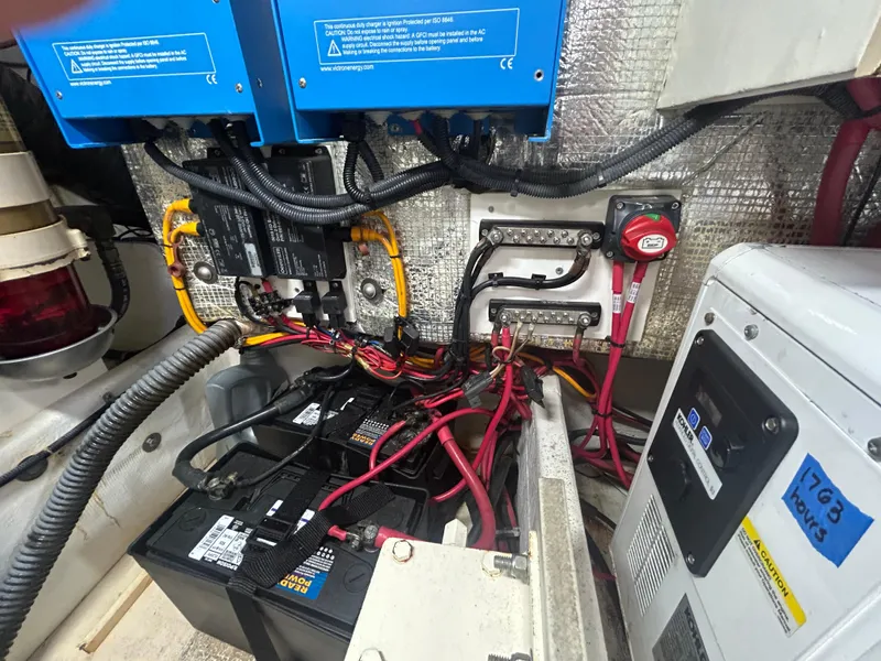 Slide: The Image of Electrical system of a 1998 Tiara Yachts 3500 Express, featuring batteries and wiring components. - 36