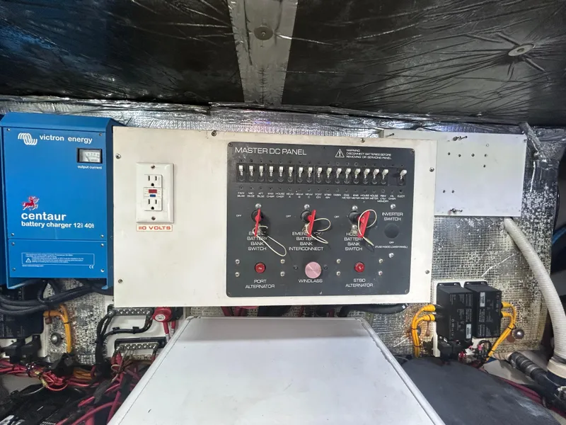 Slide: The Image of Electrical control panel on a 1998 Tiara Yachts 3500 Express, featuring a Victron Energy charger. - 38