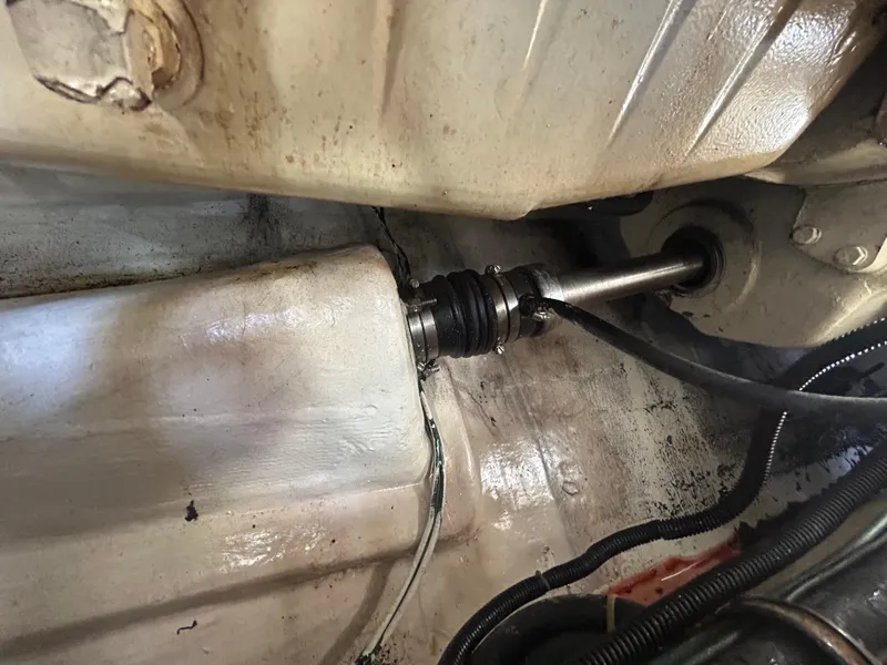 Slide: The Image of Engine compartment of a 1998 Tiara Yachts 3500 Express, showing mechanical components and wiring. - 39