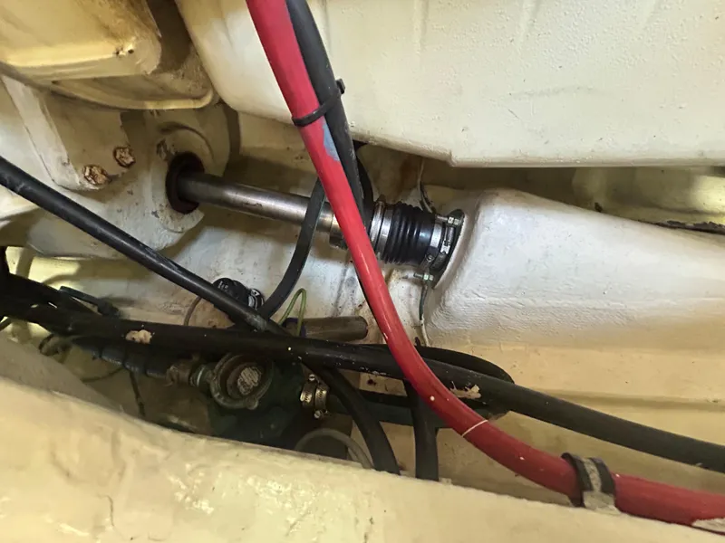 Slide: The Image of Engine compartment of a 1998 Tiara Yachts 3500 Express, showing cables and mechanical components. - 41