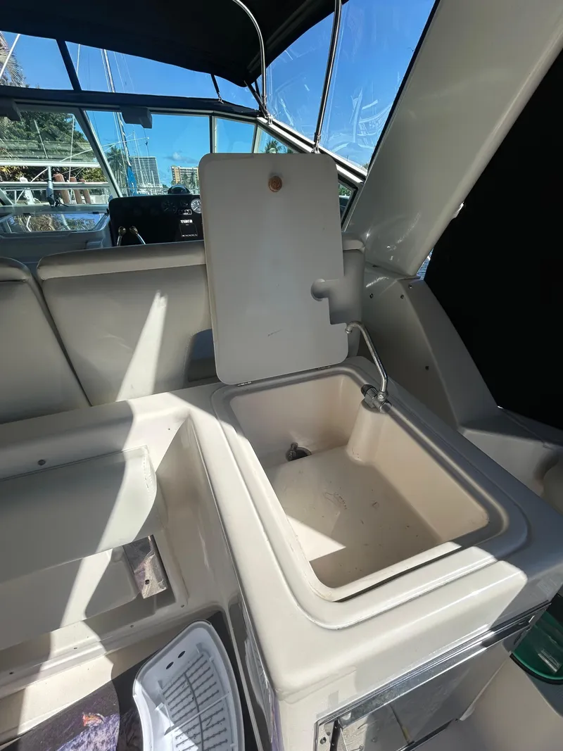 Slide: The Image of 1998 Tiara Yachts 3500 Express interior sink and counter area. - 44