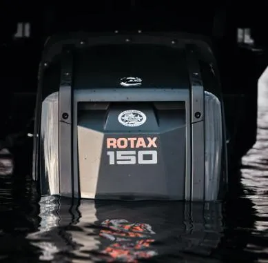 Slide: The Image of 2025 Manitou 22 Explore MAX with 150hp Rotax Stealth motor in water. - 8