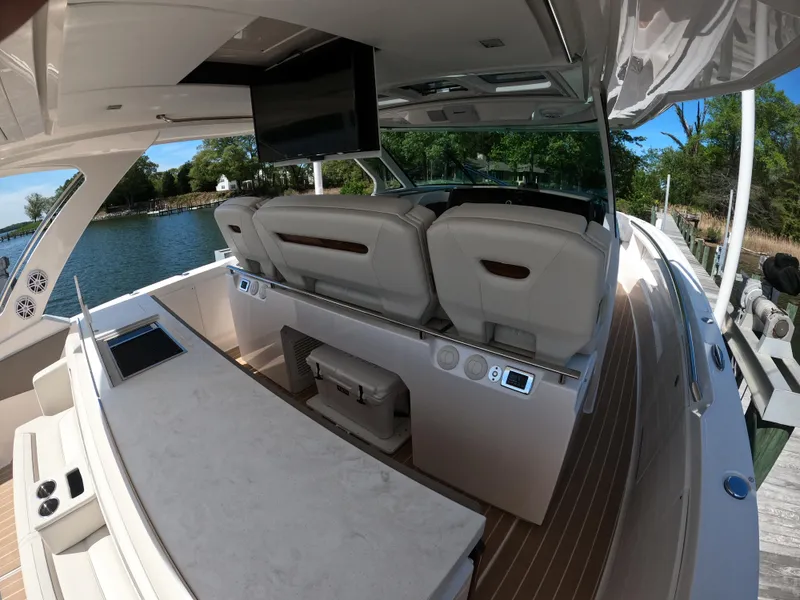 Slide: The Image of 2024 Tiara Yachts 43 LS interior with luxurious seating and modern amenities. - 11