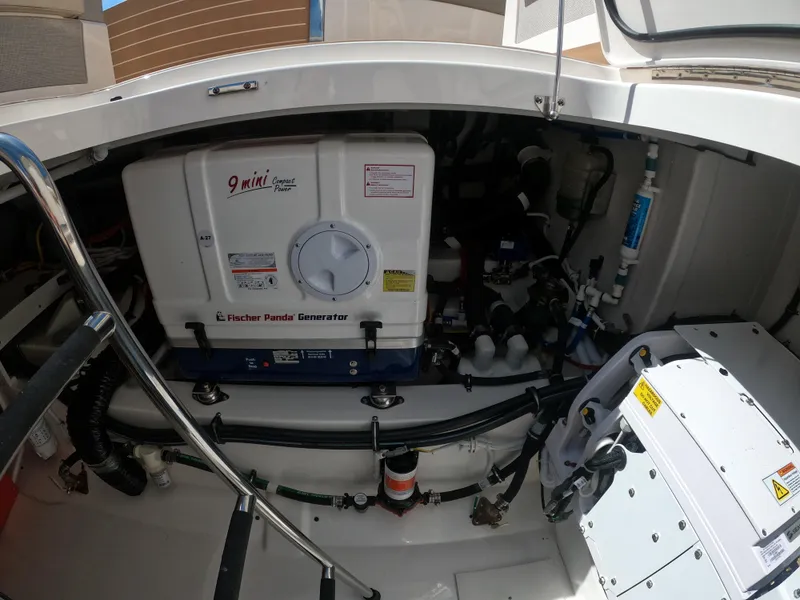Slide: The Image of Engine compartment of 2024 Tiara Yachts 43 LS, featuring Fischer Panda generator. - 23